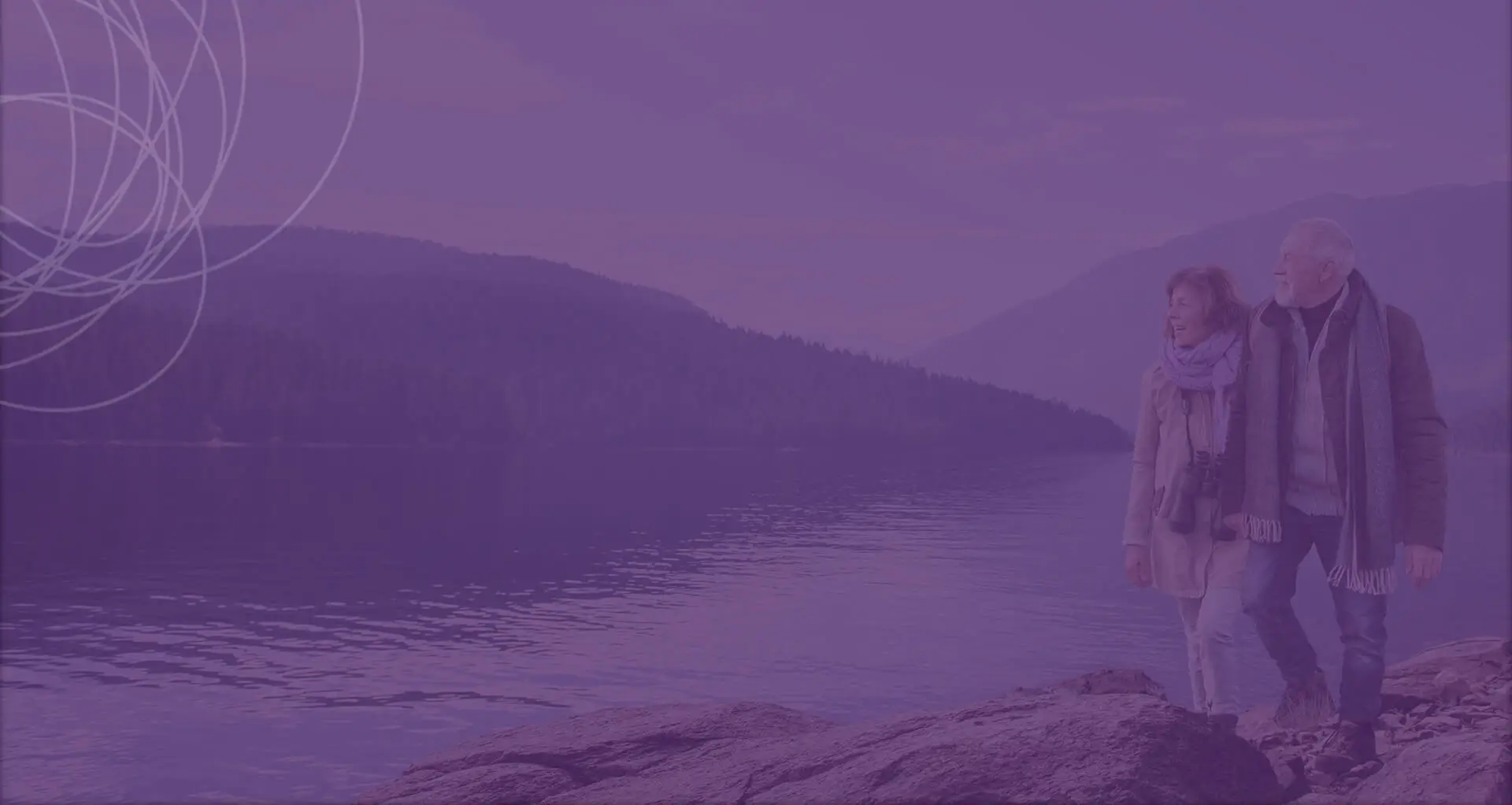 Couple walking by a lake 